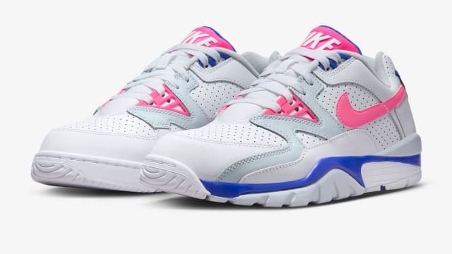 Side view of white, pink, and blue Nike sneakers.